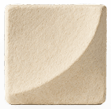 Finished cream-coloured mycelium acoustic panel with a soft curved corner
